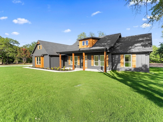 1705 J E, Woody, Springtown, TX 76082 - back of property featuring a lawn, board and batten siding, and a shingled roof