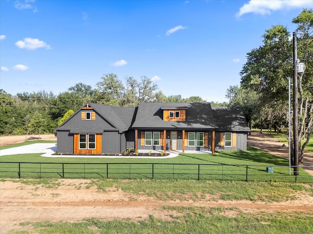 1705 J E, Woody, Springtown, TX 76082 - view of front facade with a porch and board and batten siding