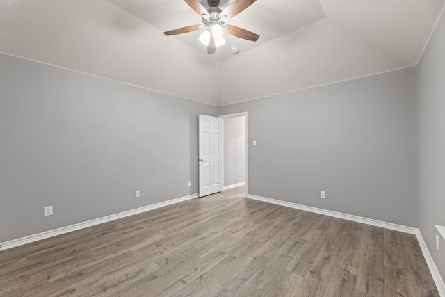 1317 Ocotillo, Fort Worth, TX 76177 - spare room featuring ceiling fan, wood finished floors, vaulted ceiling, and baseboards