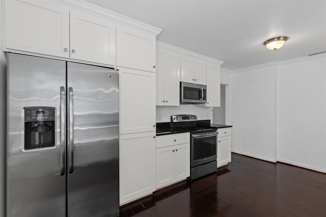 3516 Rogers Ave, Fort Worth, TX 76109 - kitchen with stainless steel appliances, dark countertops, dark wood-style floors, white cabinets, and crown molding
