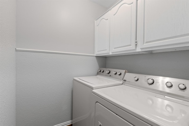 3516 Rogers Ave, Fort Worth, TX 76109 - laundry room featuring washing machine and dryer, cabinet space, and a textured wall