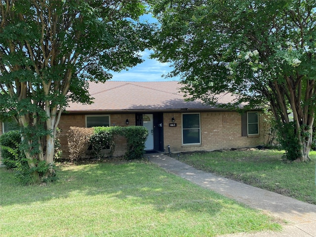 865 E Laureland Rd, Dallas, TX 75241 - view of front of house with brick siding, a front yard, and roof with shingles
