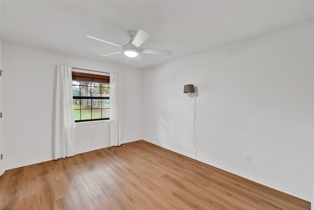 413 Timberlake Dr, Azle, TX 76020 - unfurnished room with light wood-style floors, a ceiling fan, and baseboards