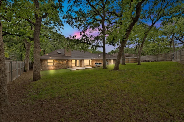 413 Timberlake Dr, Azle, TX 76020 - back of property featuring brick siding, a patio, a chimney, and a tiled roof