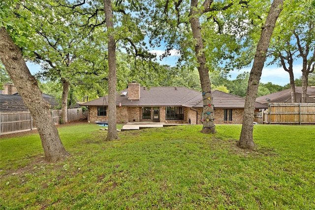 413 Timberlake Dr, Azle, TX 76020 - rear view of property featuring a chimney, brick siding, a patio, and a tile roof