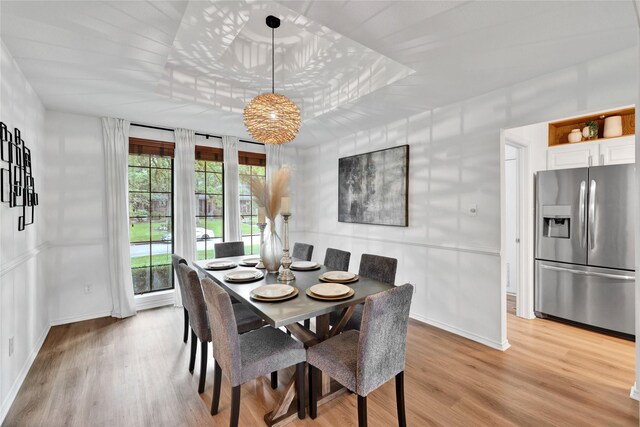 413 Timberlake Dr, Azle, TX 76020 - dining room with a raised ceiling, baseboards, and light wood-style flooring