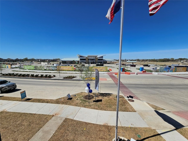 1836 Summer Aura, Mesquite, TX 75181 - view of concrete road with sidewalks and curbs
