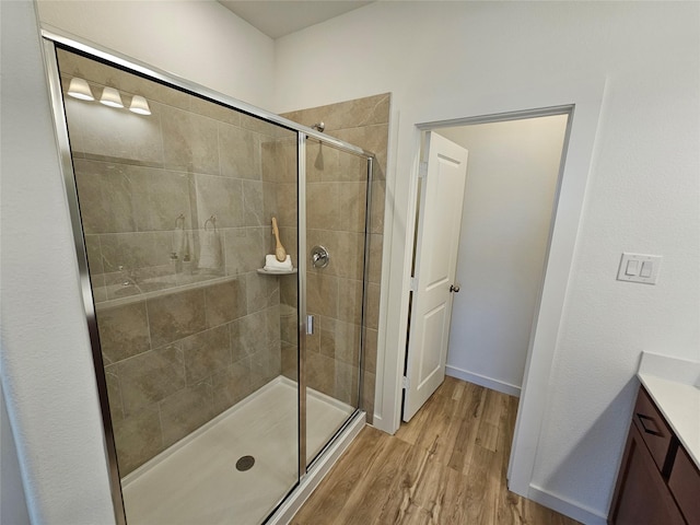 1836 Summer Aura, Mesquite, TX 75181 - full bath featuring vanity, a stall shower, wood finished floors, and baseboards