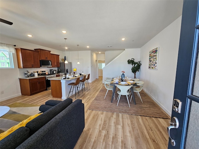 1836 Summer Aura, Mesquite, TX 75181 - dining area with light wood-type flooring, baseboards, and recessed lighting