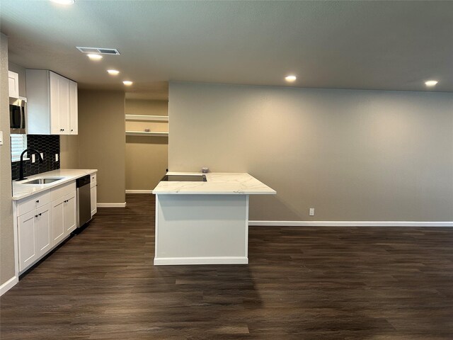 3837 Burning Tree Ln, Garland, TX 75042 - unfurnished living room featuring dark wood-style flooring, baseboards, recessed lighting, french doors, and a fireplace