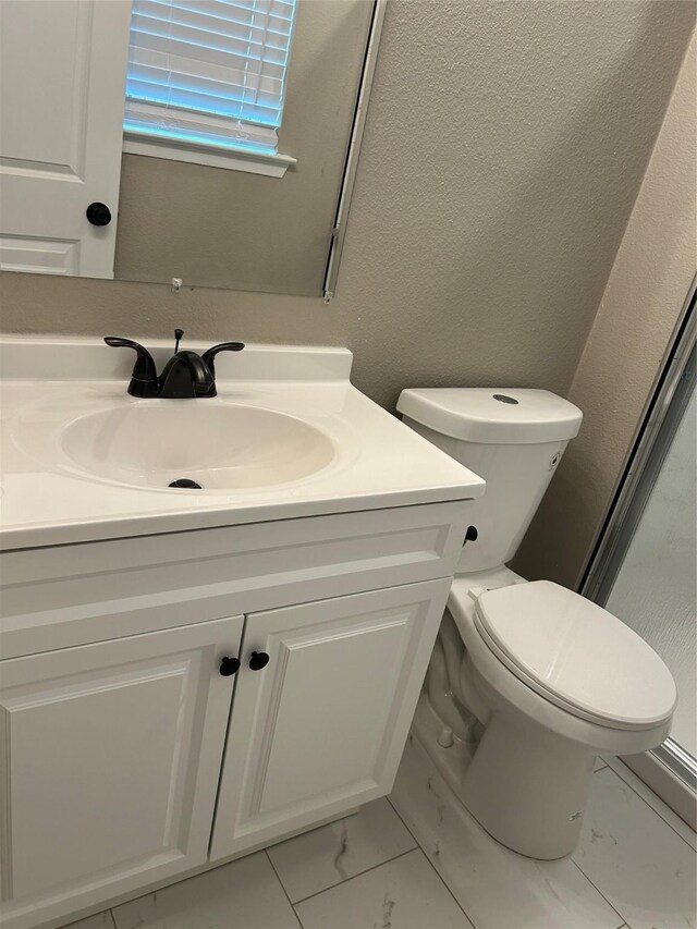 3837 Burning Tree Ln, Garland, TX 75042 - full bath with vanity, toilet, a shower stall, and recessed lighting