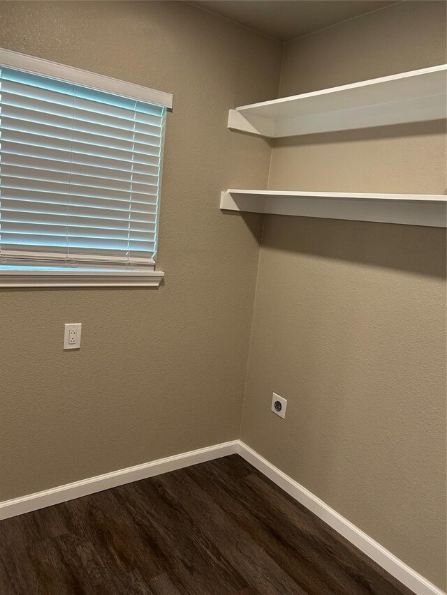 3837 Burning Tree Ln, Garland, TX 75042 - laundry area featuring hookup for a washing machine, dark wood-type flooring, and baseboards