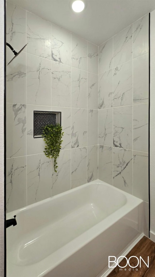 1742 S 5th St, Abilene, TX 79602 - full bath featuring wood finished floors and washtub / shower combination
