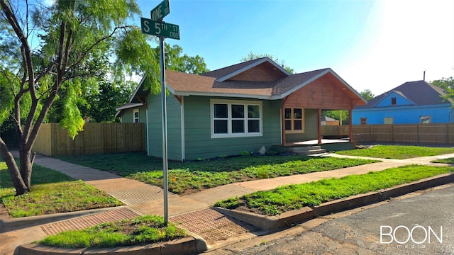 1742 S 5th St, Abilene, TX 79602 - view of front of home featuring a porch and a shingled roof