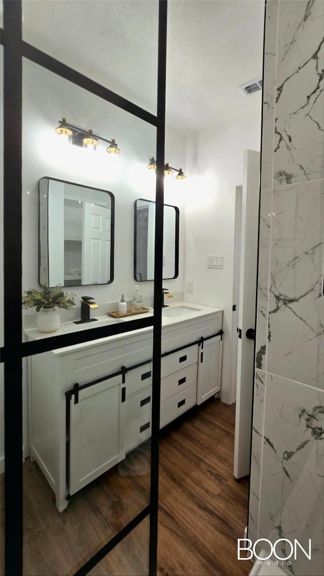 1742 S 5th St, Abilene, TX 79602 - full bath with double vanity and wood finished floors