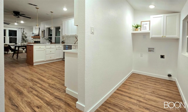 1742 S 5th St, Abilene, TX 79602 - laundry area with washer hookup, hookup for an electric dryer, a ceiling fan, wood finished floors, and recessed lighting