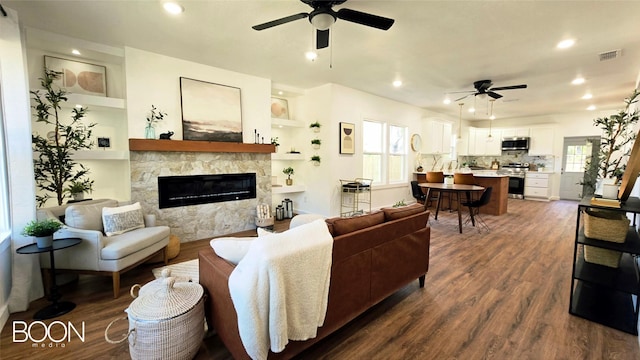 1742 S 5th St, Abilene, TX 79602 - living area with a ceiling fan, a glass covered fireplace, dark wood-style floors, and recessed lighting