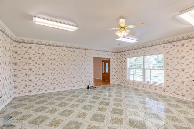 13063 Rainey Ridge Ln, Abilene, TX 79602 - spare room featuring ceiling fan, crown molding, wallpapered walls, and baseboards