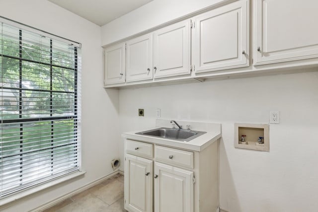1094 Edith Cir, Richardson, TX 75080 - washroom with washer hookup, hookup for an electric dryer, cabinet space, baseboards, and light tile patterned flooring