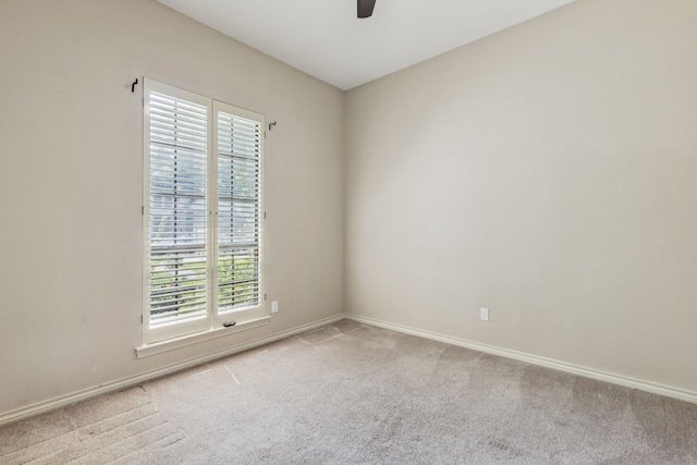 1094 Edith Cir, Richardson, TX 75080 - empty room with light colored carpet, ceiling fan, plenty of natural light, and baseboards