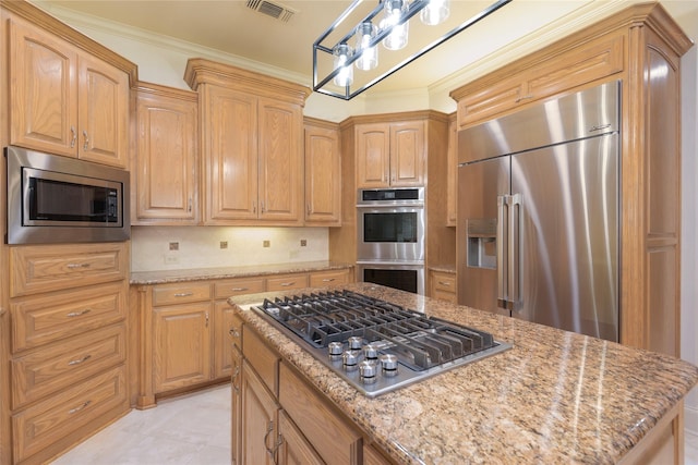 906 Glen Rose Dr, Allen, TX 75013 - kitchen with stainless steel appliances, light stone counters, ornamental molding, tasteful backsplash, and pendant lighting