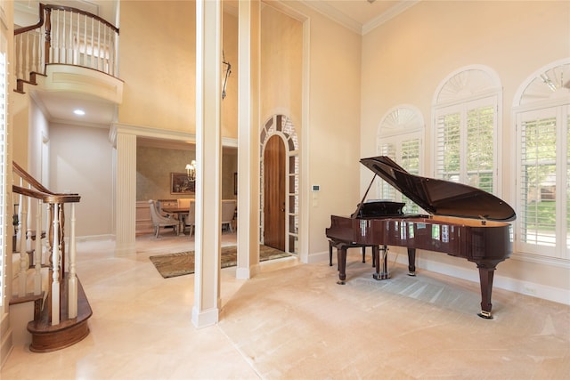906 Glen Rose Dr, Allen, TX 75013 - living area with a high ceiling, stairs, ornamental molding, baseboards, and decorative columns