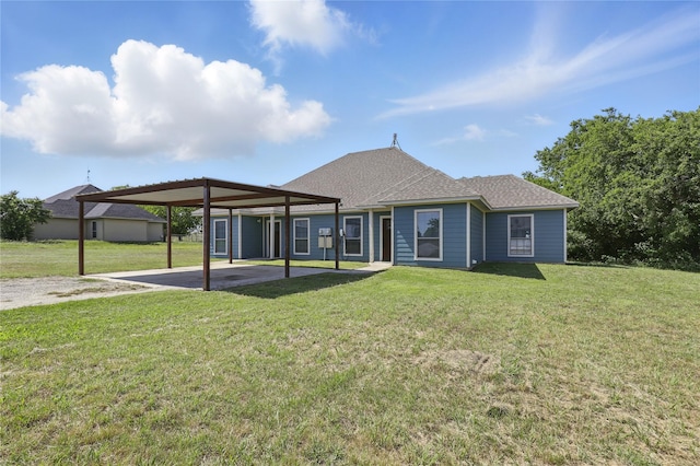 121 Collett Ct, Weatherford, TX 76088 - rear view of house featuring a yard, a shingled roof, a carport, and driveway