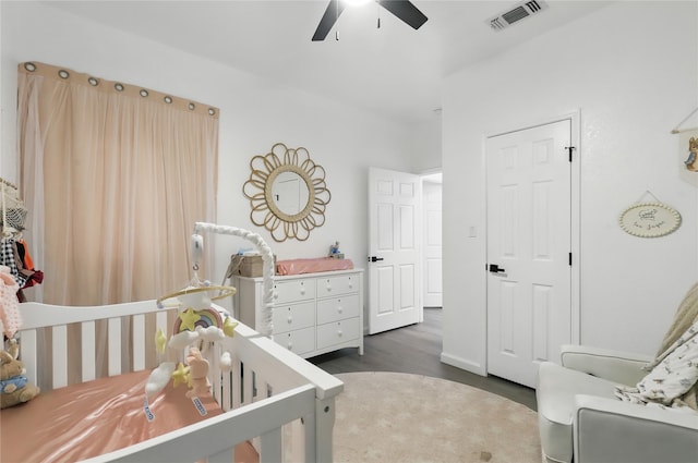 121 Collett Ct, Weatherford, TX 76088 - bedroom with a crib, wood finished floors, and ceiling fan