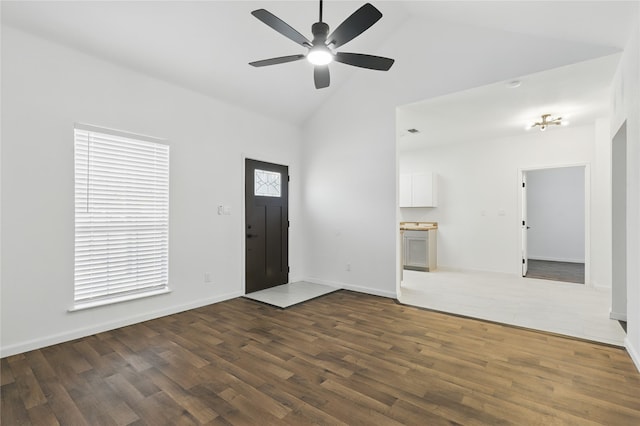 121 Collett Ct, Weatherford, TX 76088 - foyer featuring high vaulted ceiling, ceiling fan, dark wood finished floors, and baseboards