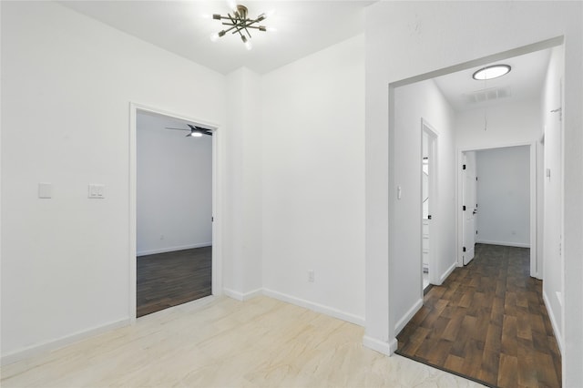 121 Collett Ct, Weatherford, TX 76088 - hallway featuring attic access, wood finished floors, and baseboards