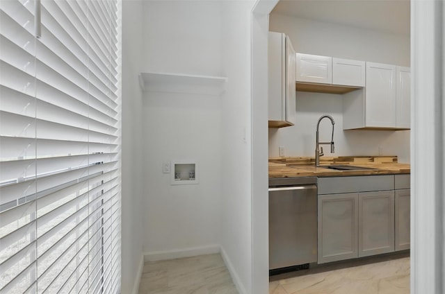 121 Collett Ct, Weatherford, TX 76088 - kitchen with dishwasher, butcher block countertops, a sink, and baseboards