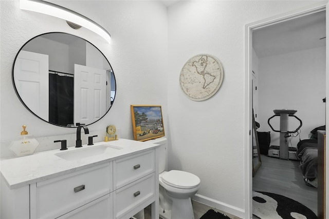 121 Collett Ct, Weatherford, TX 76088 - bathroom featuring vanity, toilet, and baseboards