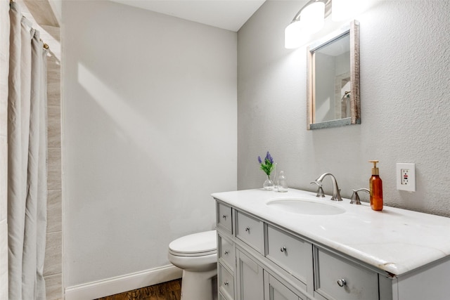 409 N Arizona, Celina, TX 75009 - bathroom featuring toilet, wood finished floors, vanity, baseboards, and a shower with shower curtain
