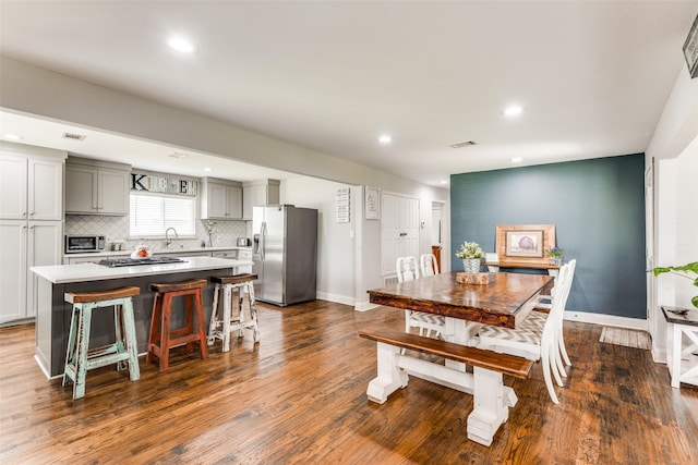 409 N Arizona, Celina, TX 75009 - dining room featuring baseboards, dark wood finished floors, and recessed lighting