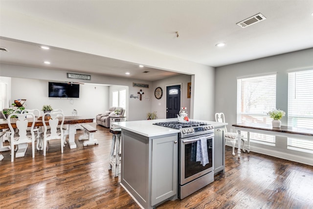 409 N Arizona, Celina, TX 75009 - kitchen with gas stove, gray cabinets, light countertops, recessed lighting, and a center island