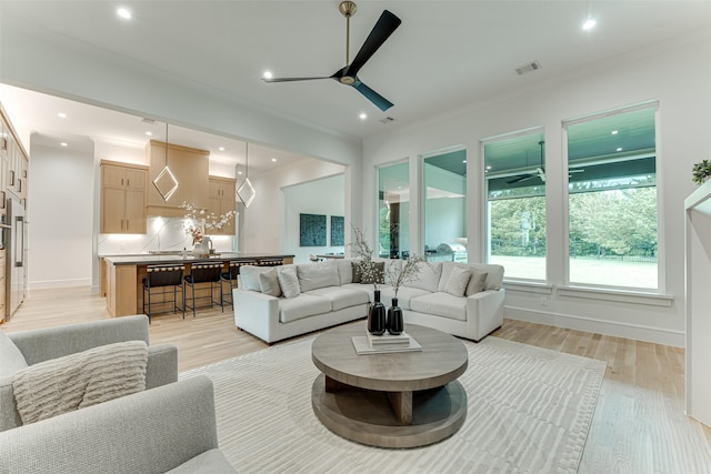 121 Sawgrass Dr, Heath, TX 75032 - living area with a ceiling fan, light wood-style floors, recessed lighting, and crown molding