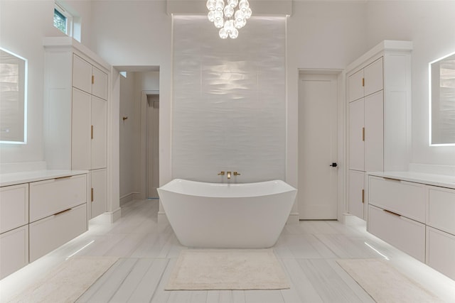 121 Sawgrass Dr, Heath, TX 75032 - bathroom featuring vanity, a freestanding bath, and a chandelier