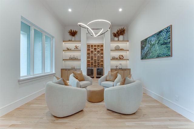 121 Sawgrass Dr, Heath, TX 75032 - living area featuring a chandelier, light wood finished floors, recessed lighting, and a bar