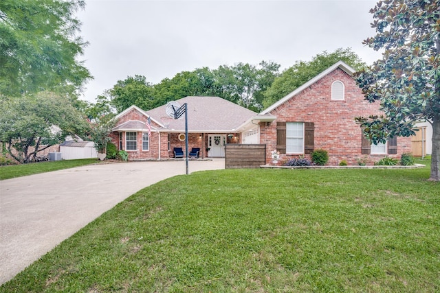 7227 N Stone Meadow Cir, Rowlett, TX 75088 - view of front of house with driveway, brick siding, and a front yard