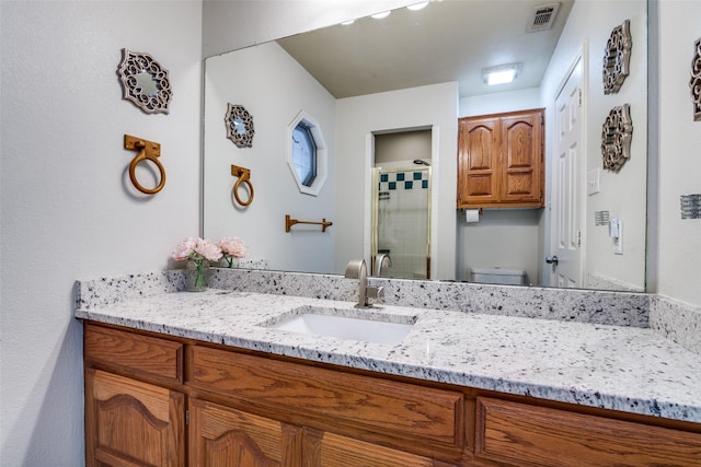 7227 N Stone Meadow Cir, Rowlett, TX 75088 - bathroom with vanity, a shower stall, and toilet