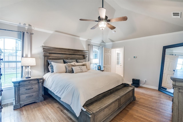 7227 N Stone Meadow Cir, Rowlett, TX 75088 - bedroom with light wood finished floors, multiple windows, ornamental molding, vaulted ceiling, and baseboards