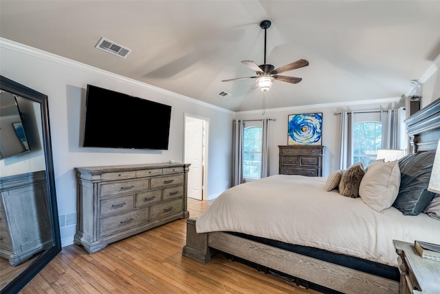 7227 N Stone Meadow Cir, Rowlett, TX 75088 - bedroom featuring light wood finished floors, ornamental molding, multiple windows, lofted ceiling, and a ceiling fan