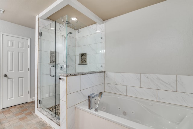 7227 N Stone Meadow Cir, Rowlett, TX 75088 - bathroom with a jetted tub, a stall shower, and stone finish floors