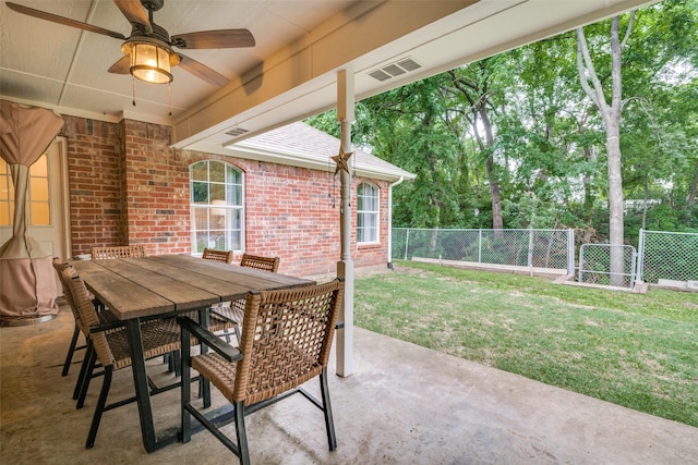 7227 N Stone Meadow Cir, Rowlett, TX 75088 - view of patio featuring a ceiling fan, outdoor dining area, and view of wooded area