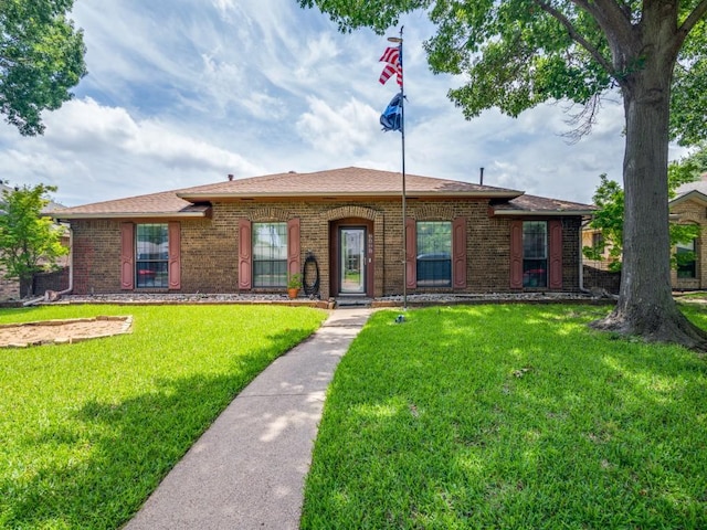 3606 Andrea Ln, Rowlett, TX 75088 - view of front of house featuring a front lawn and brick siding