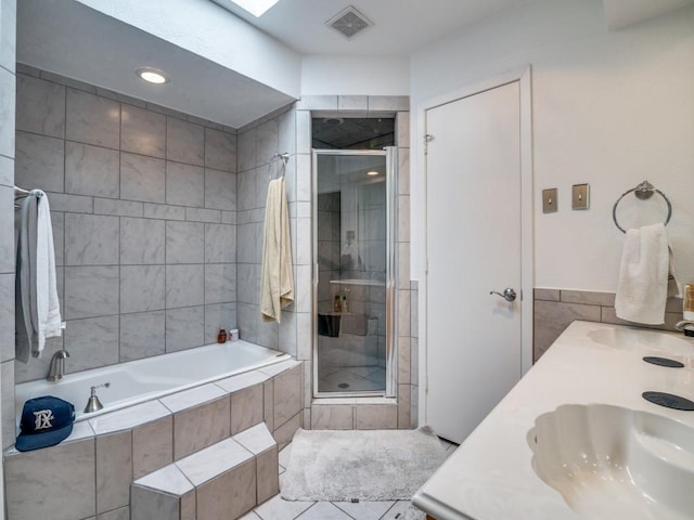3606 Andrea Ln, Rowlett, TX 75088 - bathroom with a stall shower, a bath, tile patterned floors, and double vanity