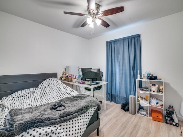 3606 Andrea Ln, Rowlett, TX 75088 - bedroom with wood finished floors, ceiling fan, and an office area