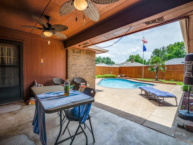 3606 Andrea Ln, Rowlett, TX 75088 - fenced backyard featuring a patio and a ceiling fan