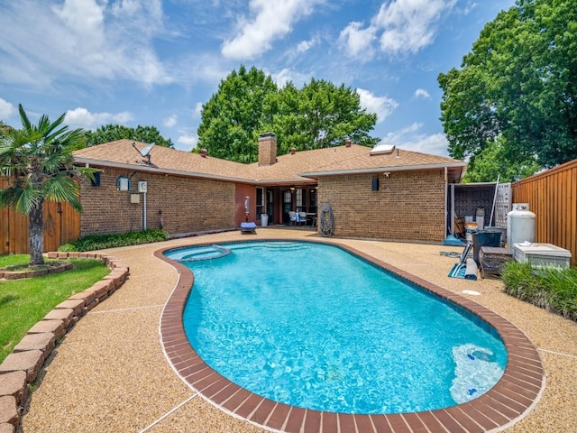3606 Andrea Ln, Rowlett, TX 75088 - view of swimming pool with a patio area and a pool with connected hot tub