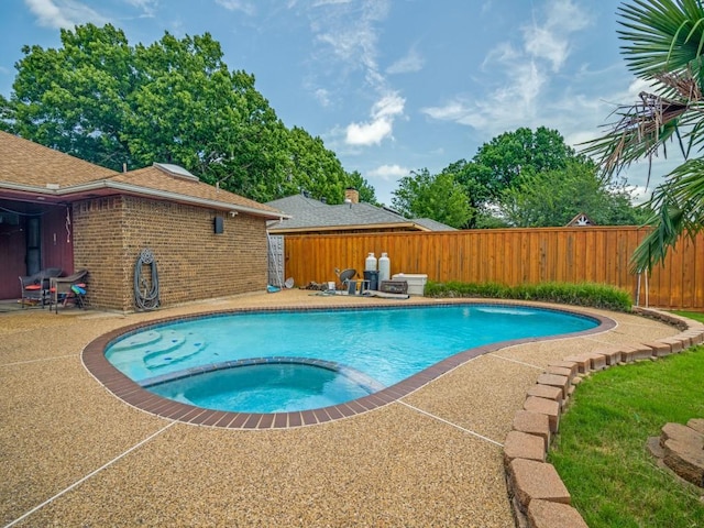 3606 Andrea Ln, Rowlett, TX 75088 - view of swimming pool featuring a fenced backyard, a patio, and a pool with connected hot tub